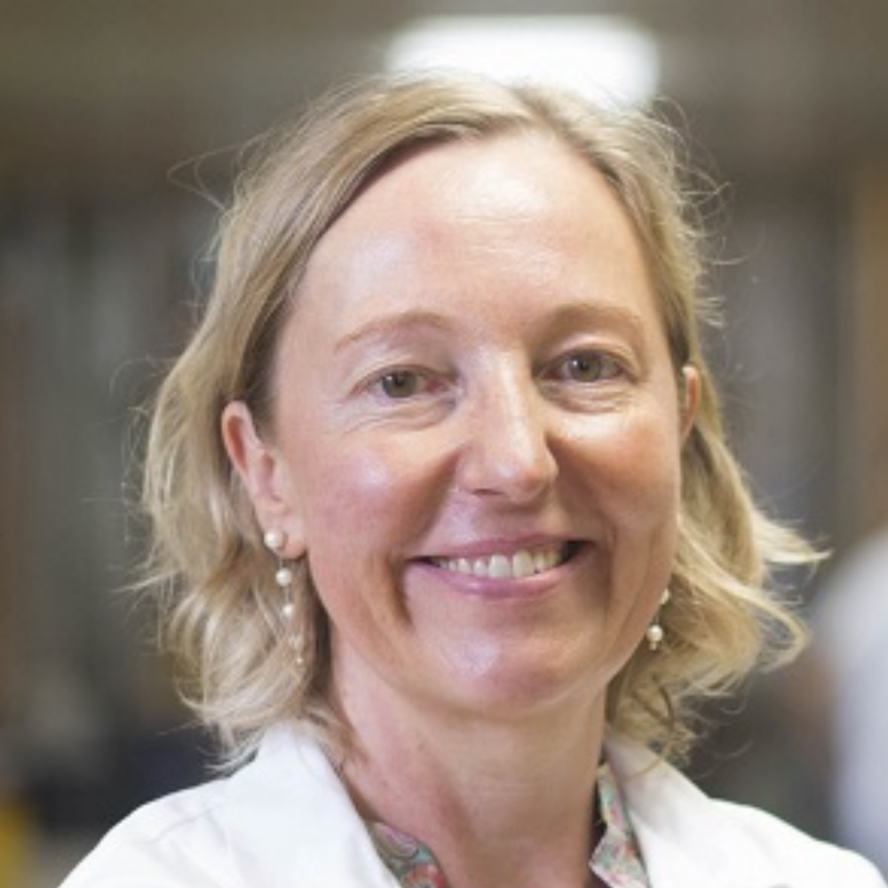 Portrait of Prof. Dr. Heike A. Bischoff-Ferrari, female interpretable, light-skinned person with blonde medium-length hair, pearl earrings, white doctor's coat